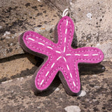 Sustainable Toy for Dogs Stanley the Starfish on stone background